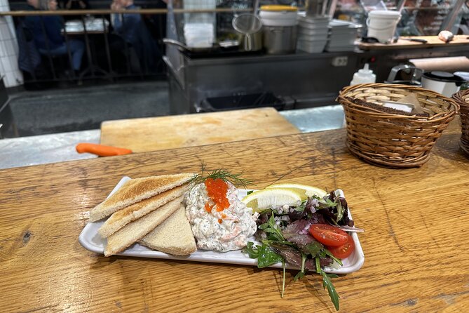 Stockholm Small Group Food Tour with 7 Classic Food Tastings - Drottninggatan and the Norrmalm Walk: Pedestrian Streets and Bridges